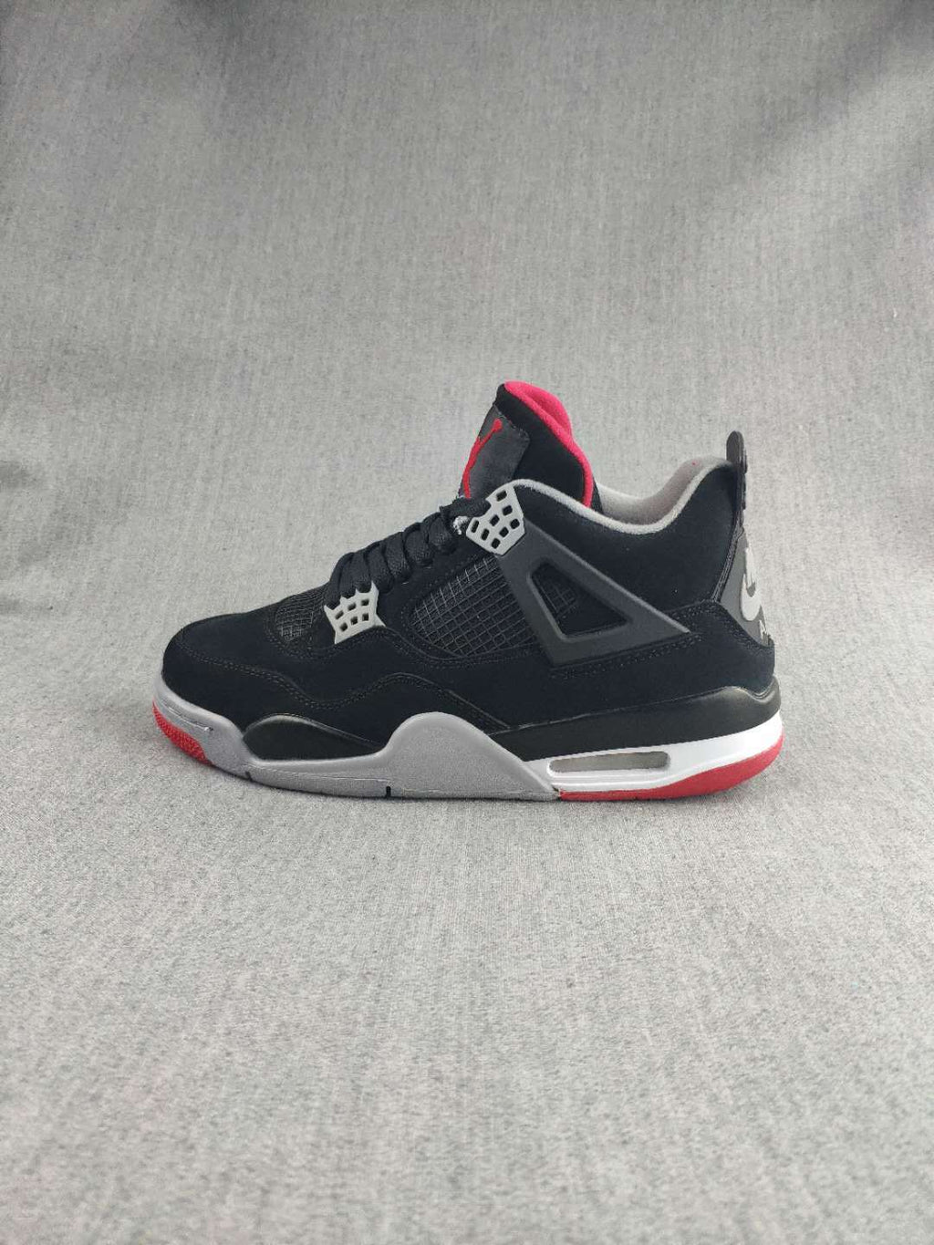 Jordan 4 Retro Sneaker in Black, Red and White