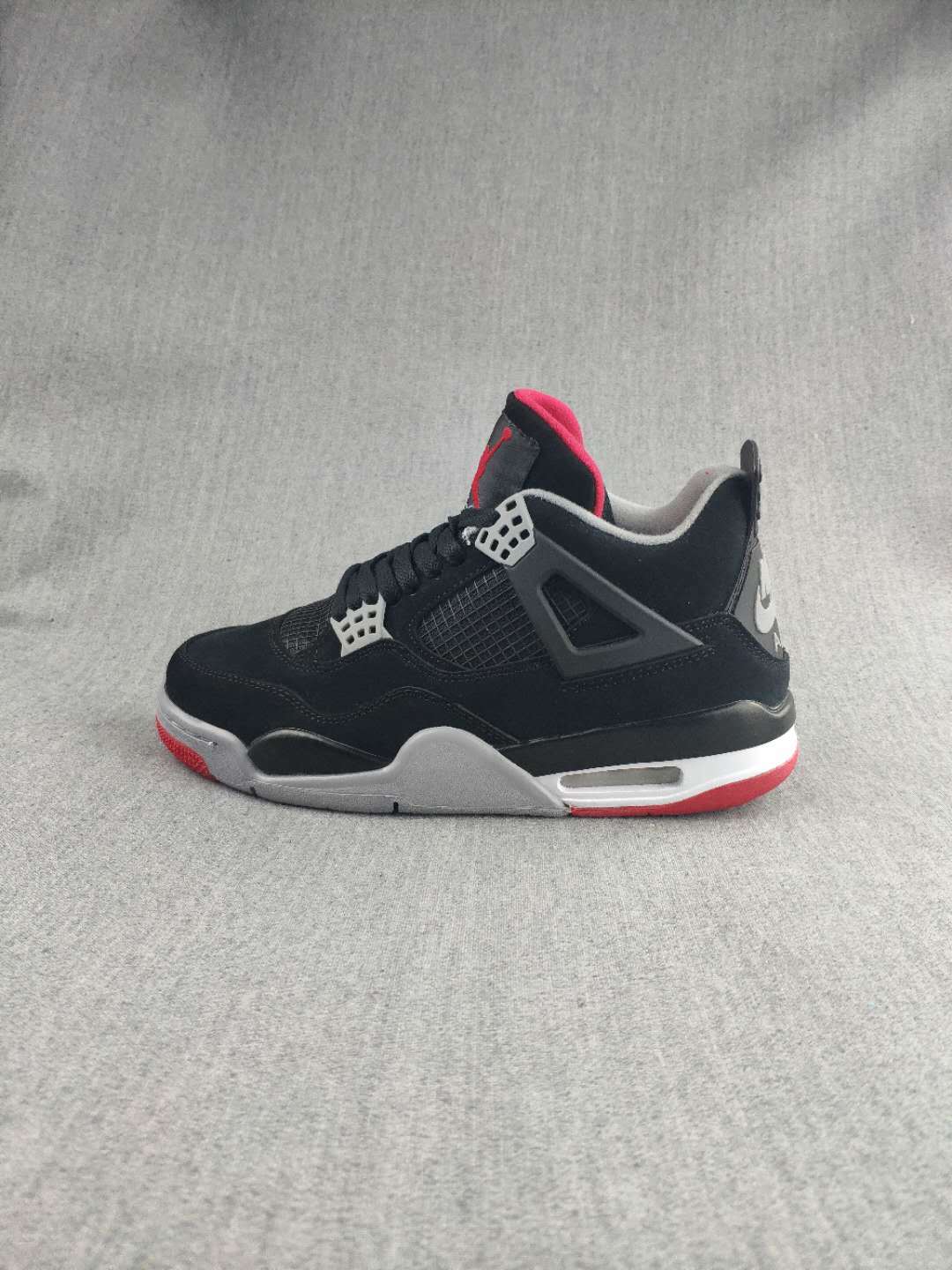 Jordan 4 Retro Sneaker in Black, Red and White