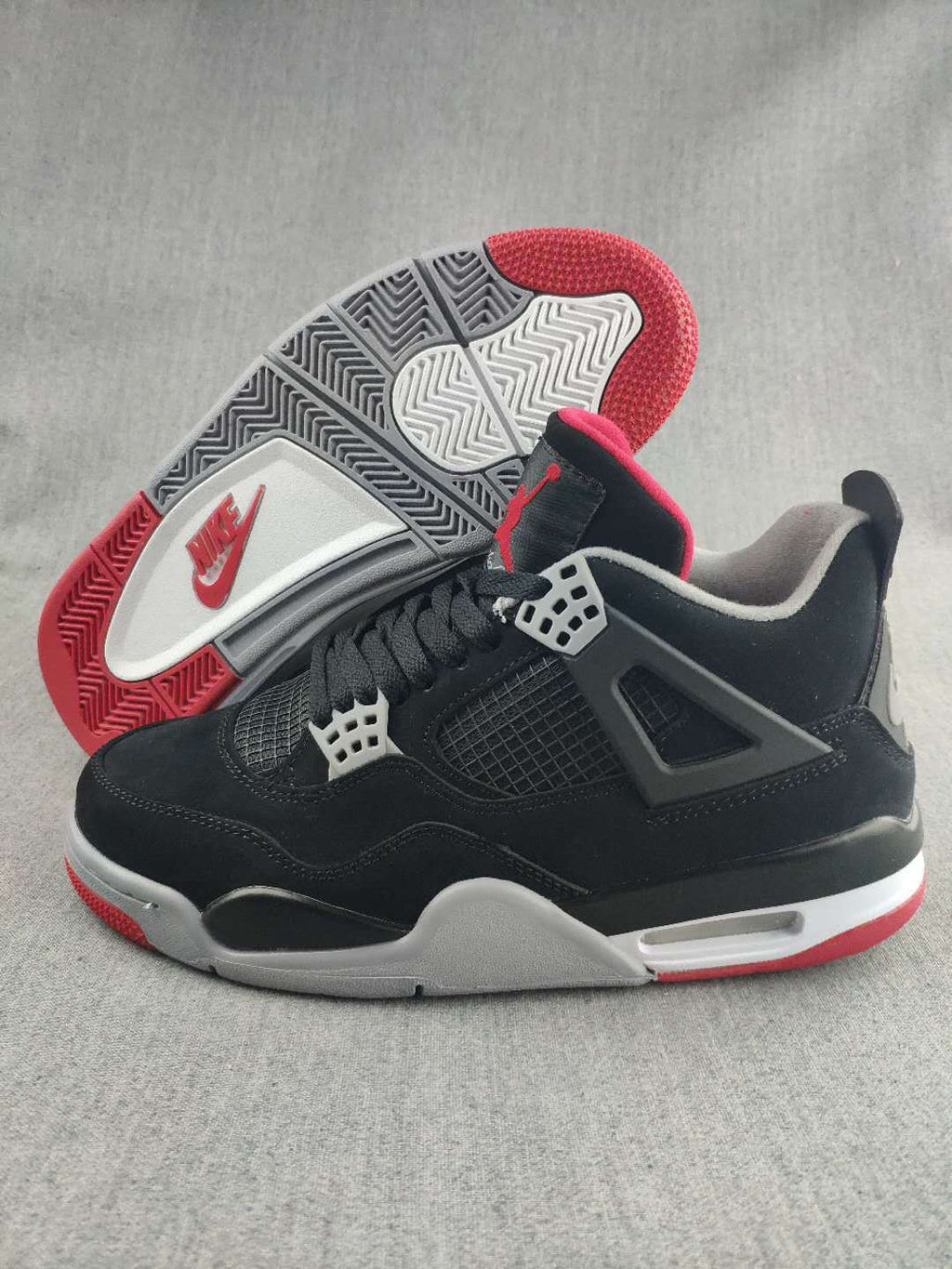 Jordan 4 Retro Sneaker in Black, Red and White