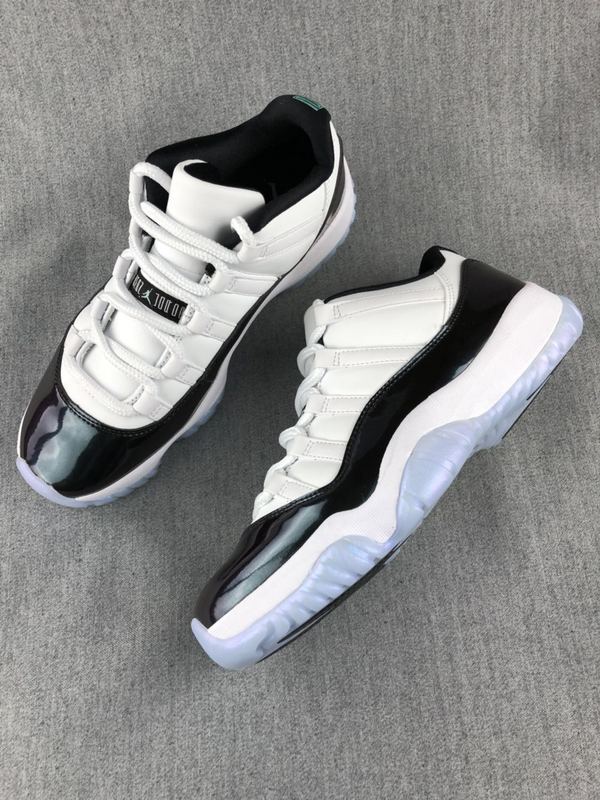 Jordan 11 Low Sneakers in White and Black