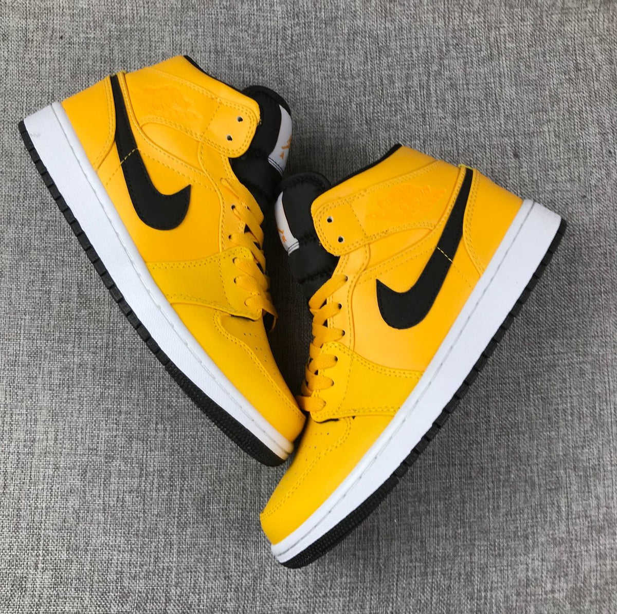 Air Jordan 1 Mid University Gold Black White Sneakers