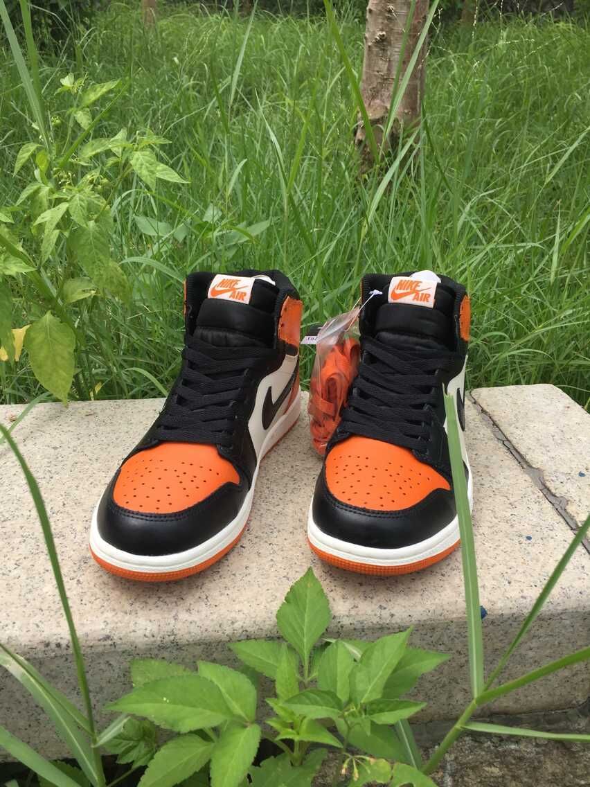 Jordan 1 High Sneakers in Black, White and Orange