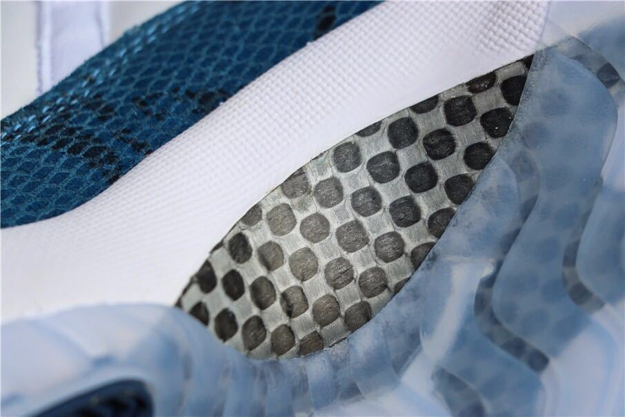 Air Jordan 11 Low Navy Snakeskin Sneakers