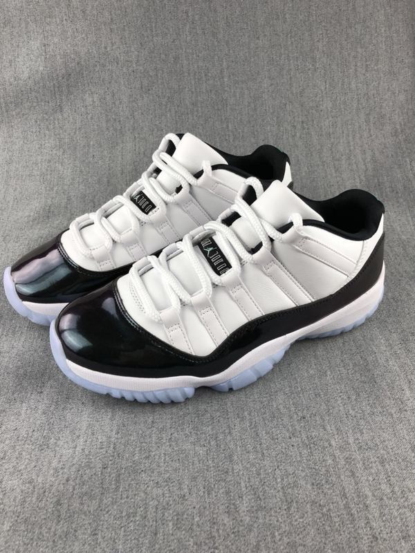 Jordan 11 Low Sneakers in White and Black