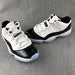 Jordan 11 Low Sneakers in White and Black