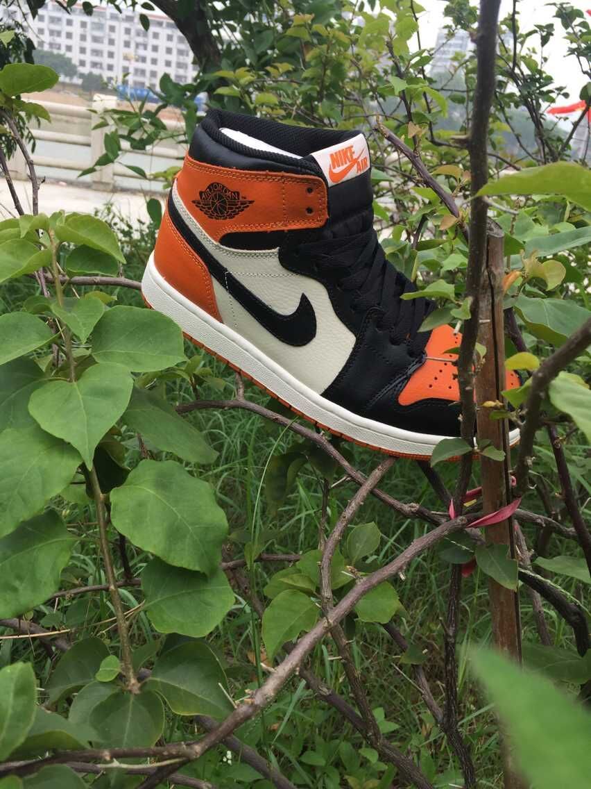 Jordan 1 High Sneakers in Black, White and Orange