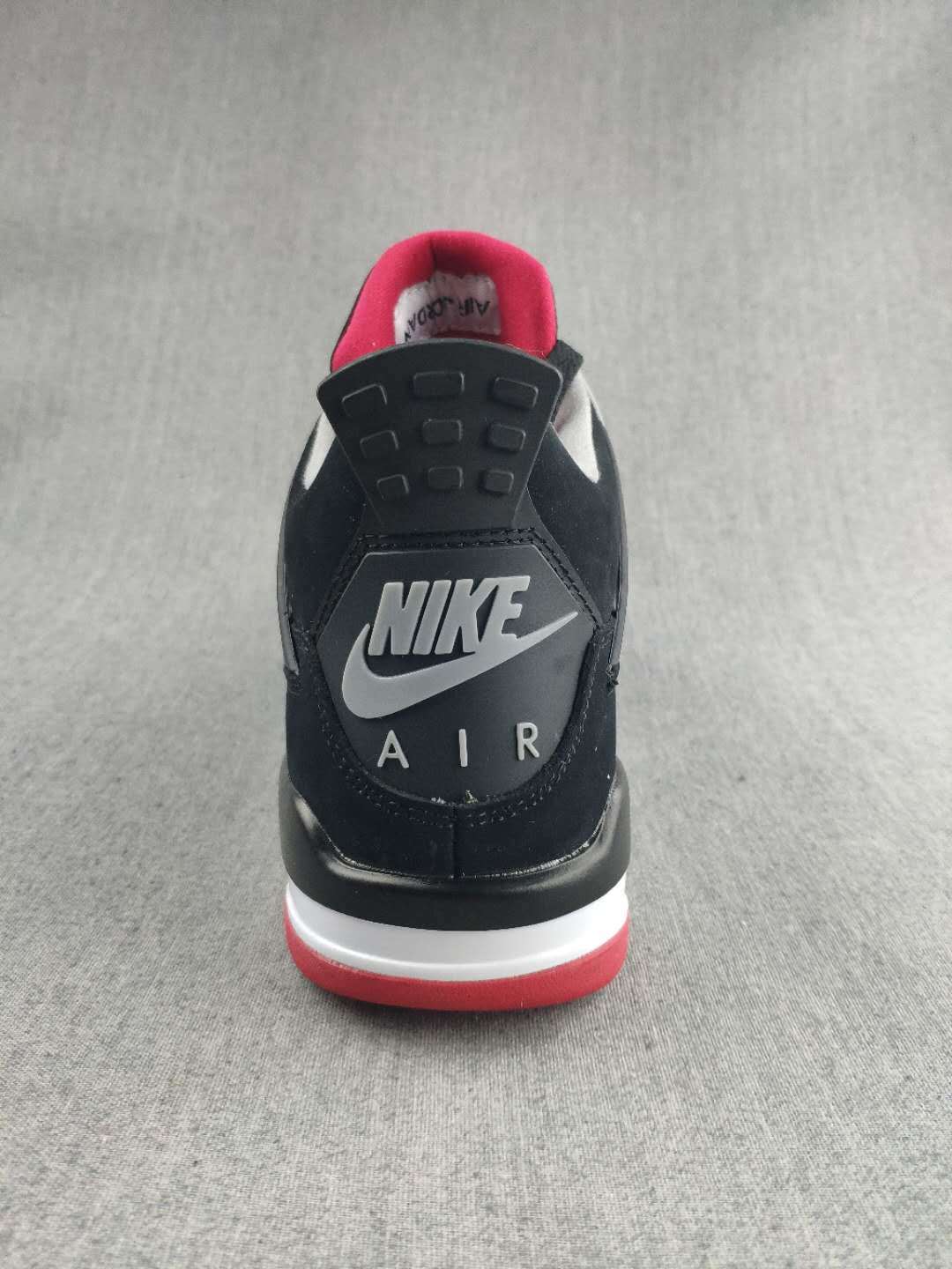 Jordan 4 Retro Sneaker in Black, Red and White